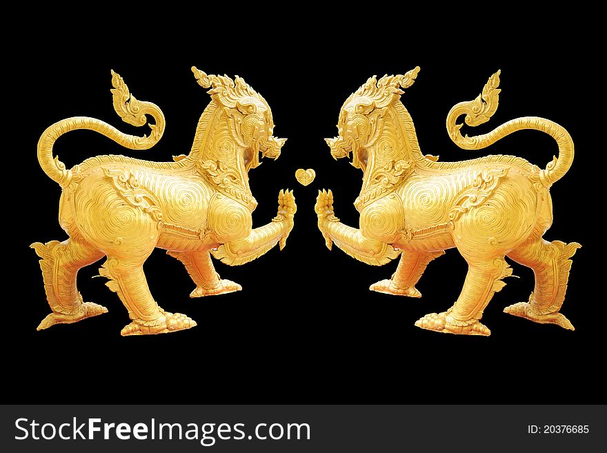 Golden Lion statue - Asian style art - isolated on black background. Golden Lion statue - Asian style art - isolated on black background.