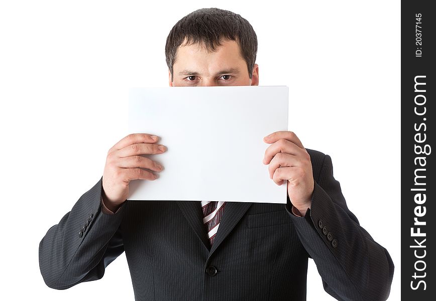 A businessman is holding a blank sheet of paper