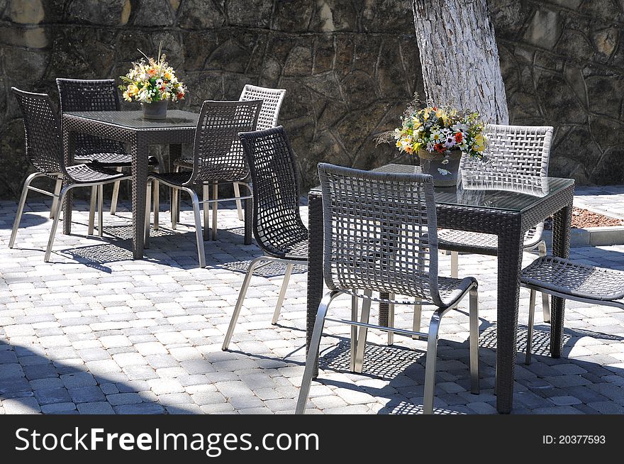 Two Tables, Bouquets And Chairs.