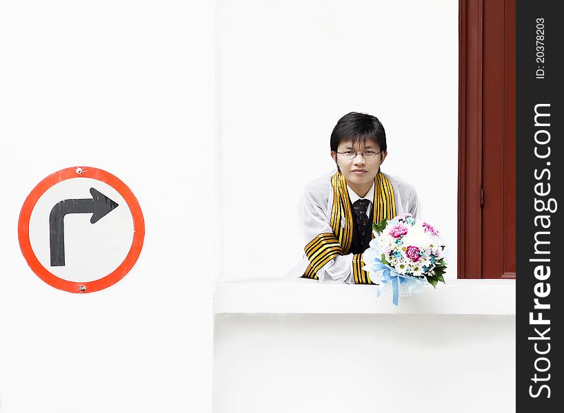Everybody must have education concept with Man holding a flower on white background. Everybody must have education concept with Man holding a flower on white background.