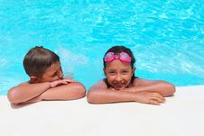 Girl And Boy Relaxing Near Swimming Pool Royalty Free Stock Images Girl And Boy Relaxing Near Swimming Pool Royalty Free Stock Images