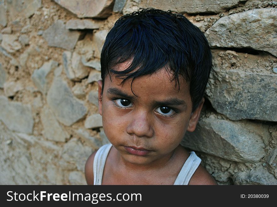 Indian rural boy posing at camera