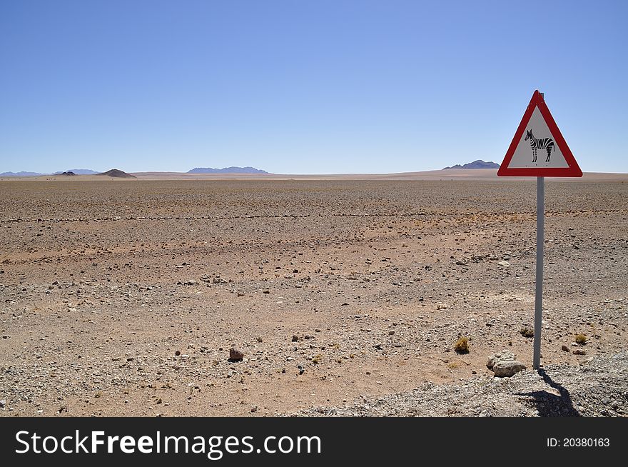 Extreme Desert with Road Sign Beware Zebra