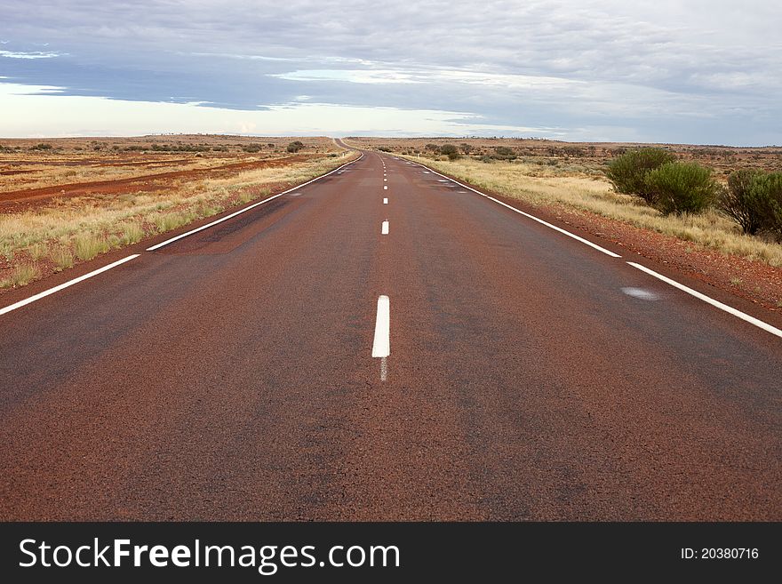 Lonely highway is going through desert. Lonely highway is going through desert