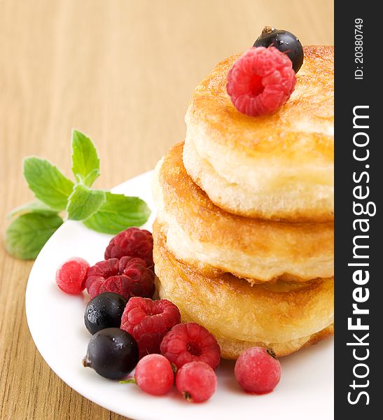 Pancakes with raspberries and black currants. Pancakes with raspberries and black currants