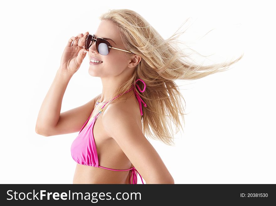 Young beautiful girl in sunglasses on white background