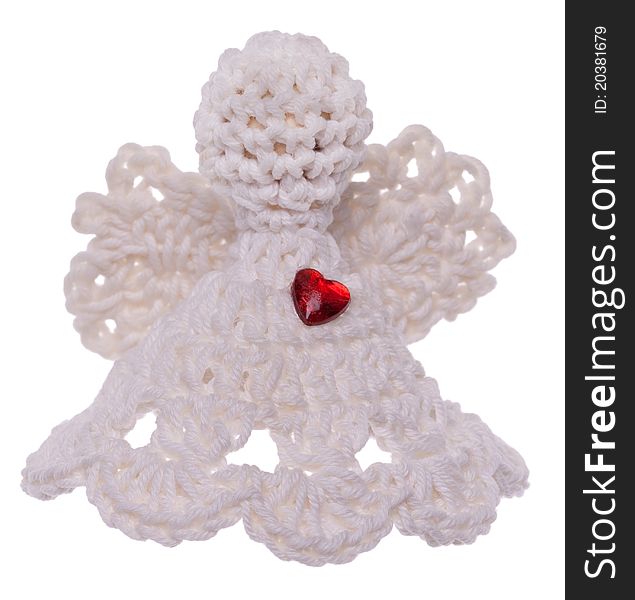 Handmade crochet Angel with a red heart isolated on white
