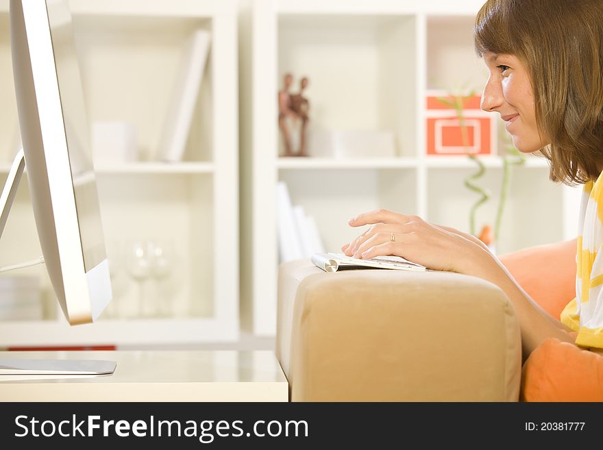 Young woman chatting in internet at home