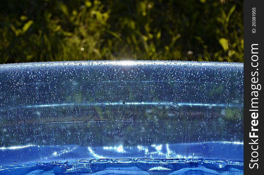 Blue inflatable swimming pool in garden. Blue inflatable swimming pool in garden