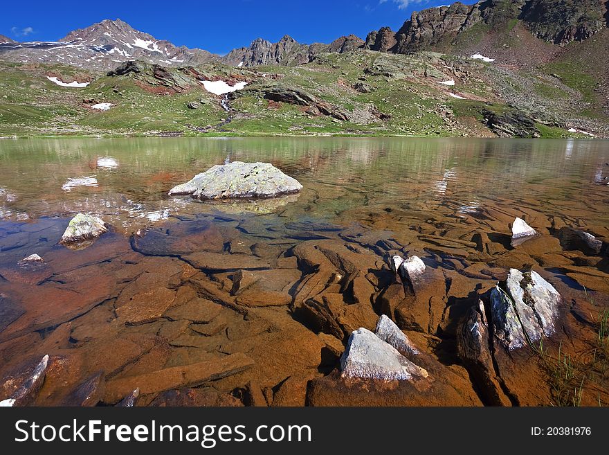 Small mountain lakes after a frozen night during summer. Small mountain lakes after a frozen night during summer