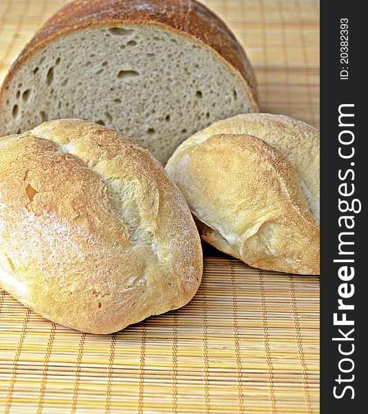 Bread and two rolls on table