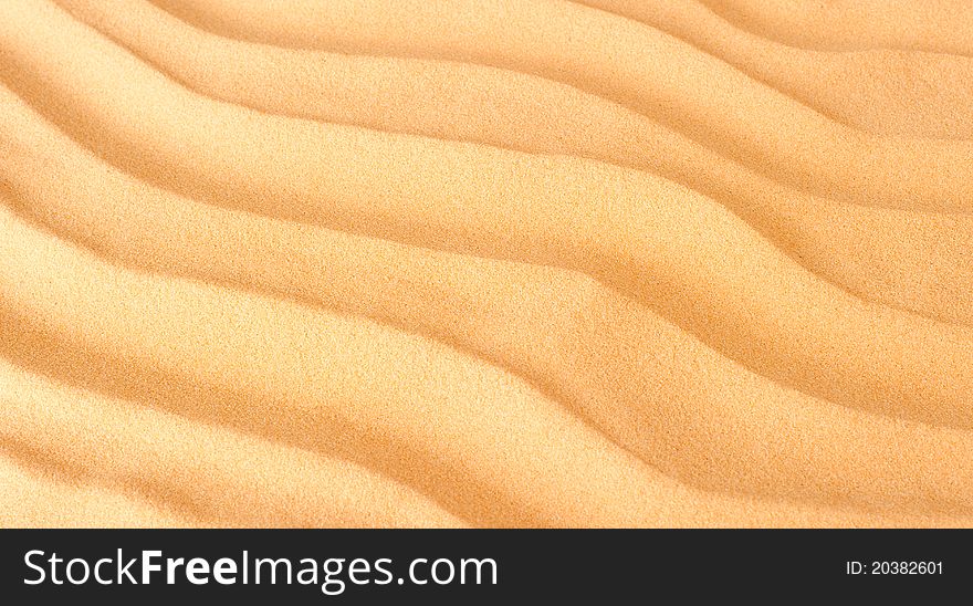 Closeup sand background with waves