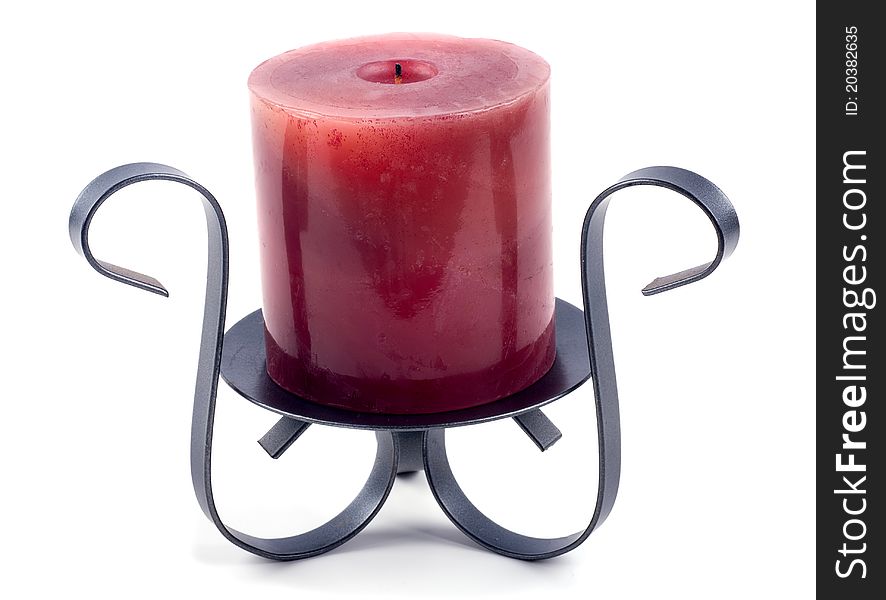 Studio shot of red candle on holder on white background