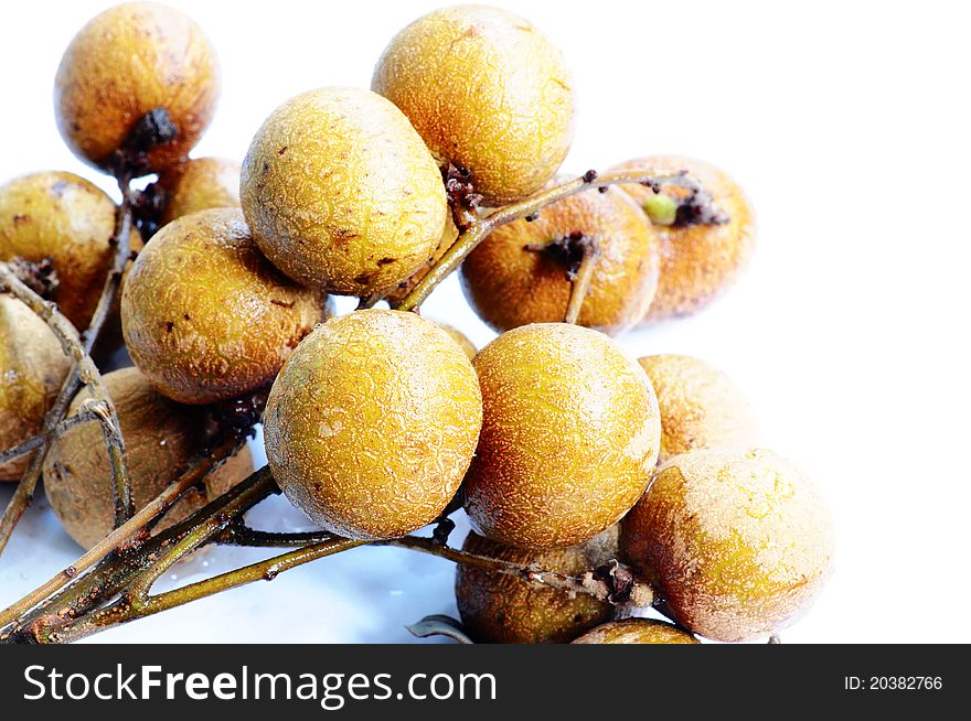 Fresh ripe longan fruits on a white background