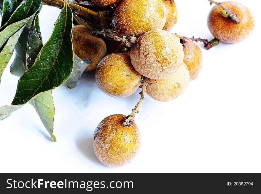 Fresh ripe longan fruits on a white background