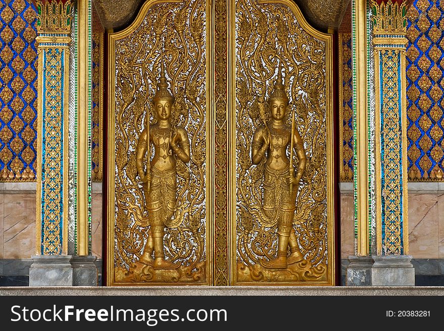 Deva statue on  door .