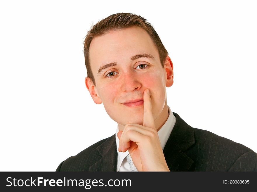 Satisfied young businessman smiling and looking at camera