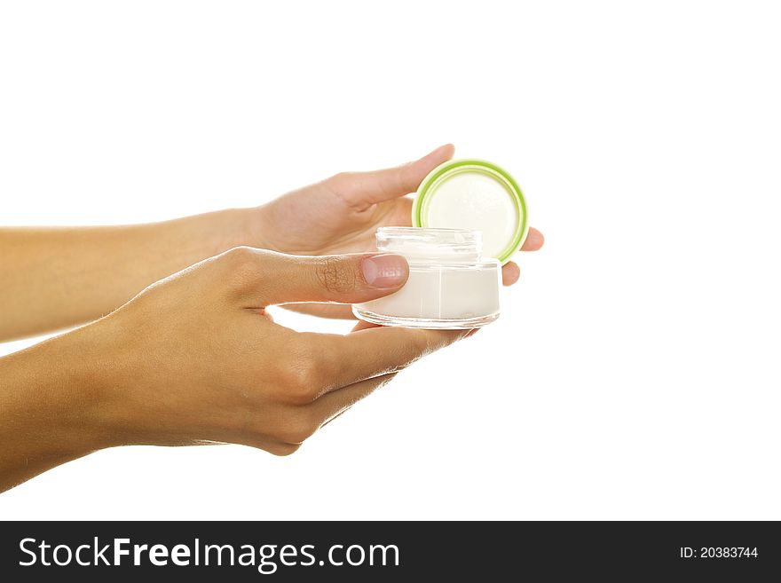 Close-up of woman hands opening a bank cream. Isolated on a white background. Close-up of woman hands opening a bank cream. Isolated on a white background