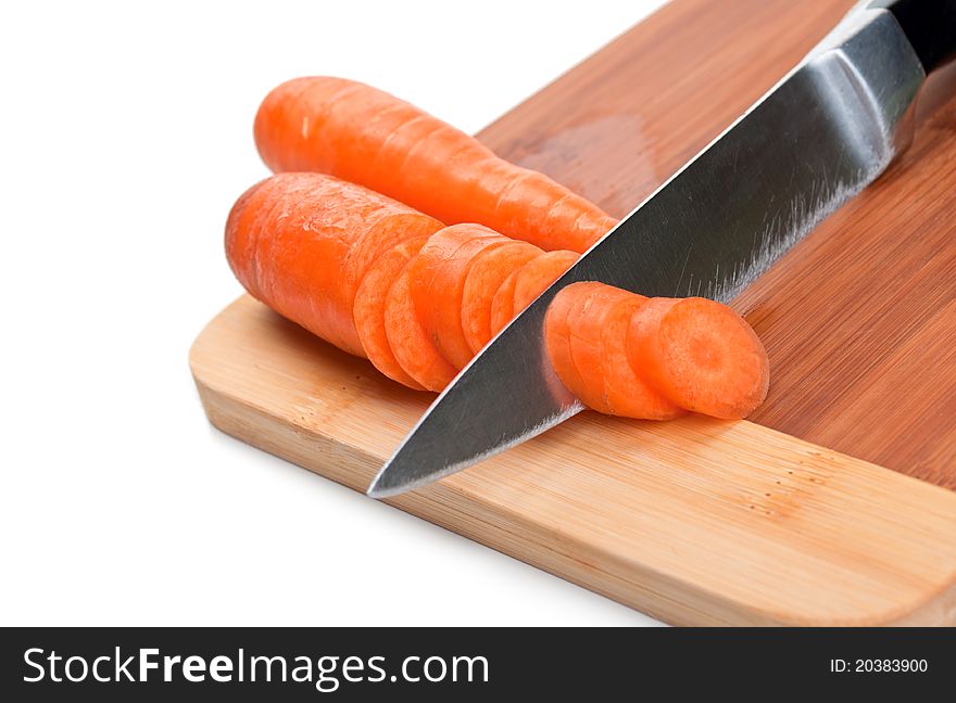 Raw carrot and knife isolated on a white background