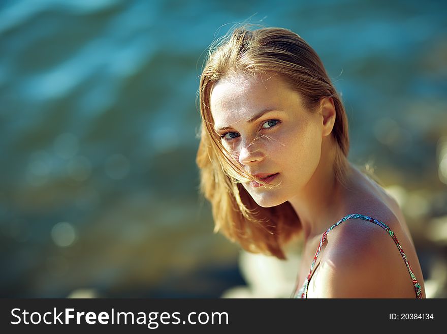 Beautiful blond woman on the beach