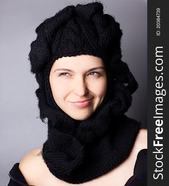 Portrait of smiling woman in cap