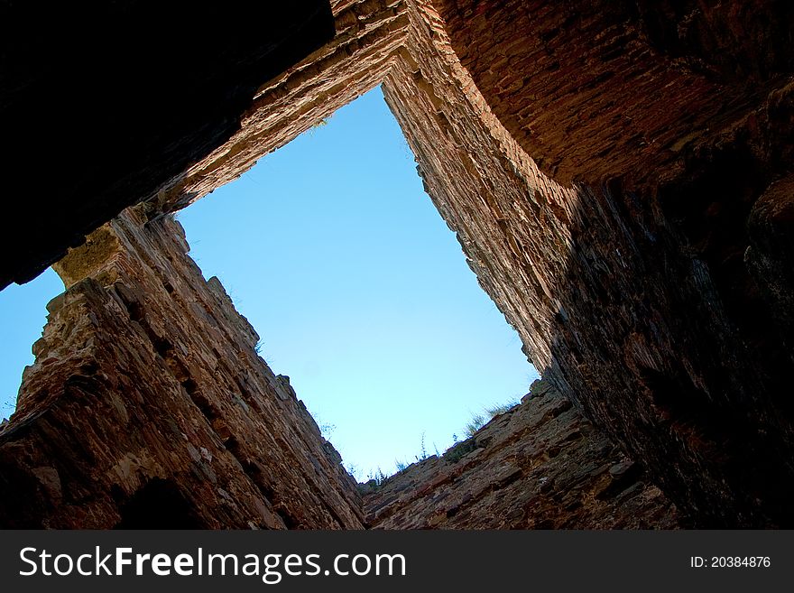 A view to the sky through an old ruins