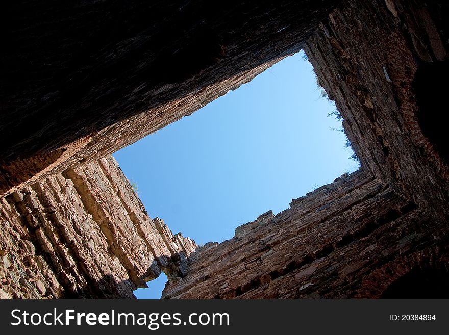 A view to the sky through an old ruins