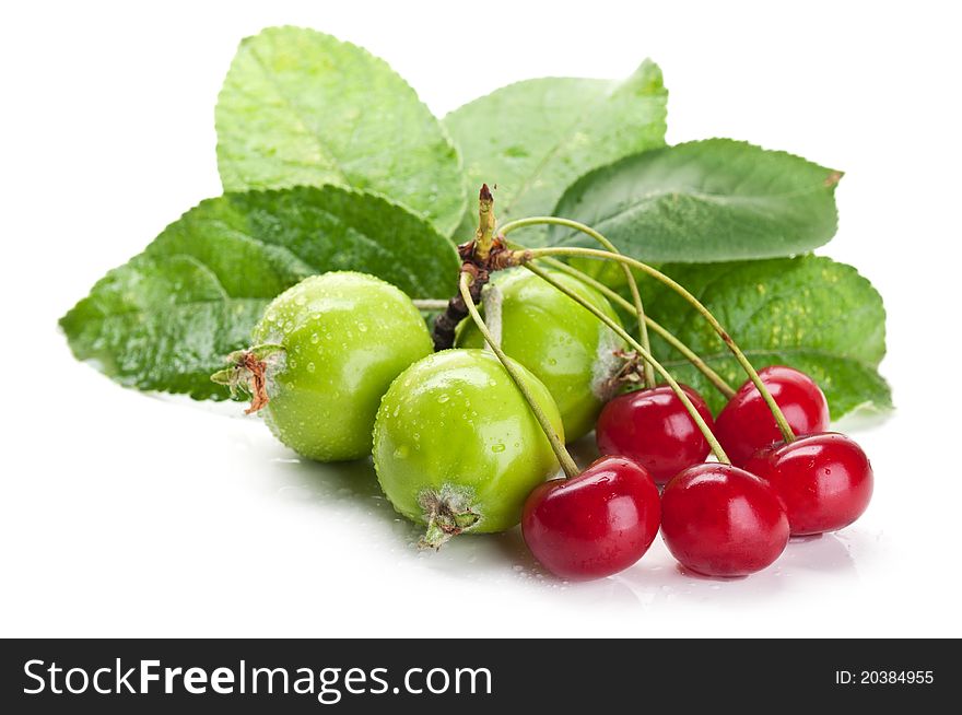 Fresh cherry and apples isolated on a white background