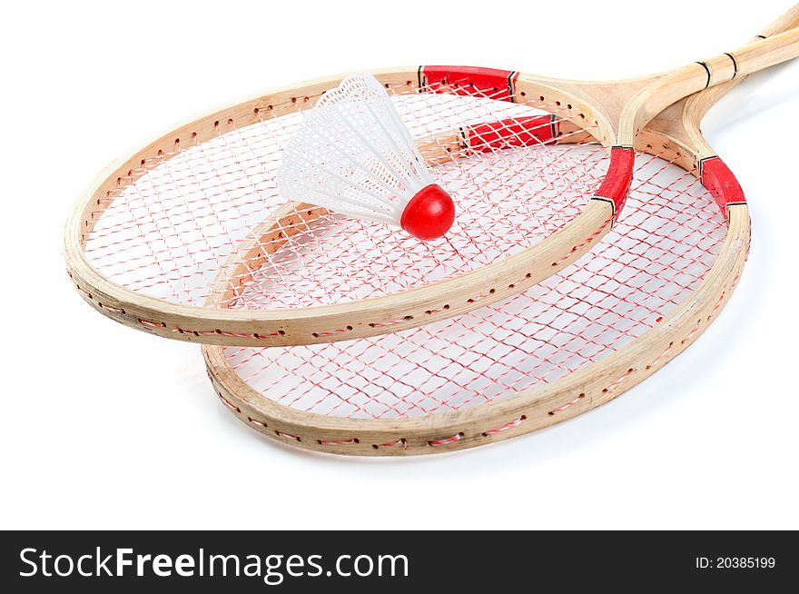 Old badminton and red shuttlecock isolated on a white background