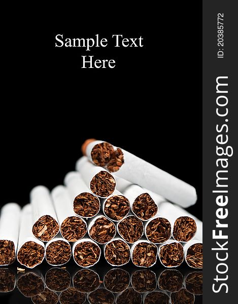 Many cigarettes isolated on a black background