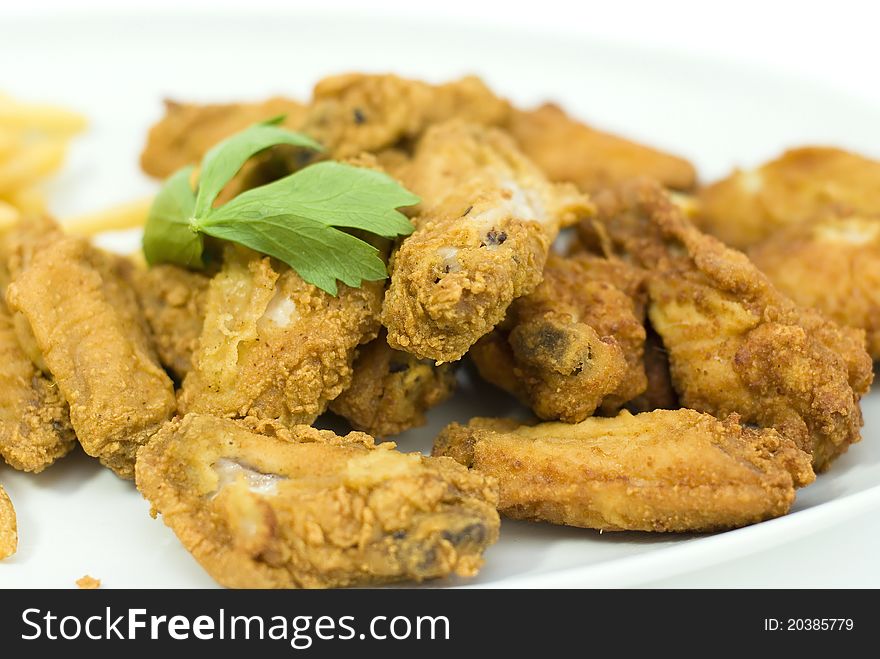 Golden fried chicken in a white plate
