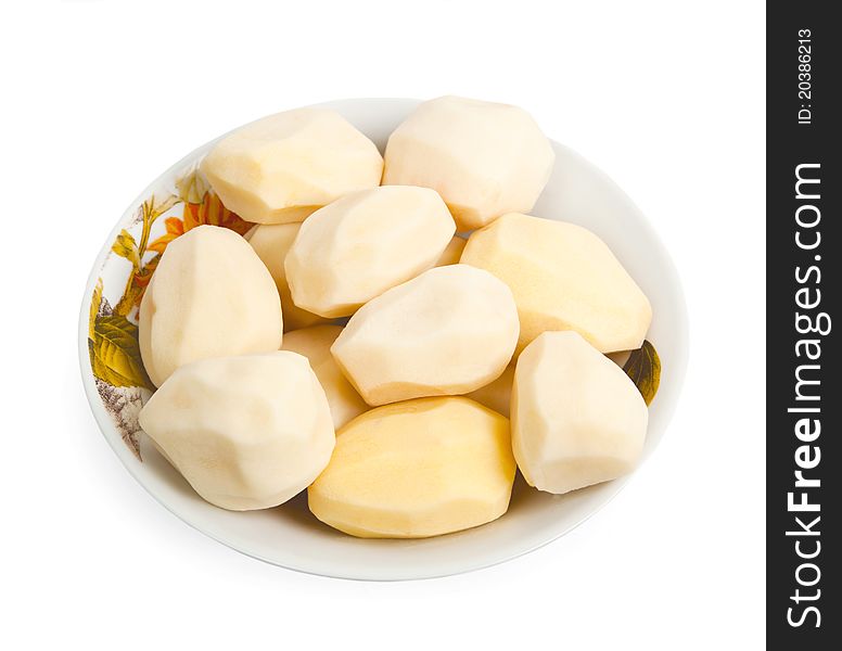 Pile of peeled potatoes on a plate, isolated