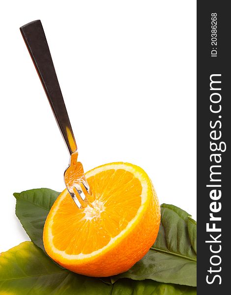 Cut orange with a plug on leaves isolated on a white background