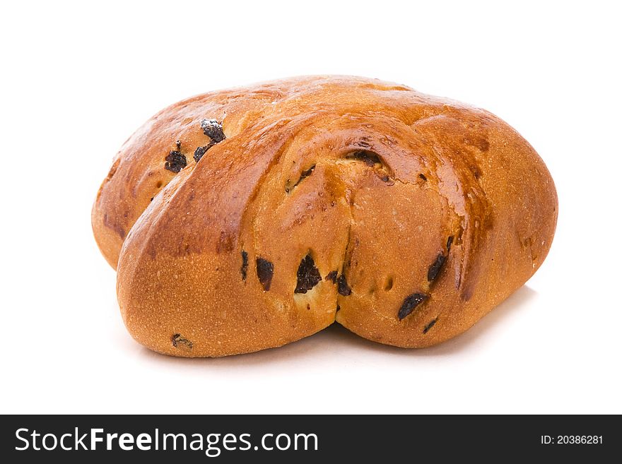 Tasty bun with raisin isolated over white background