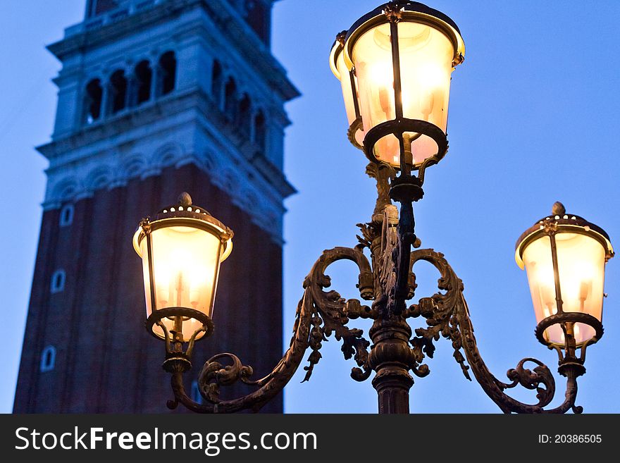 Venetian Bell Tower With Lamp In Evening