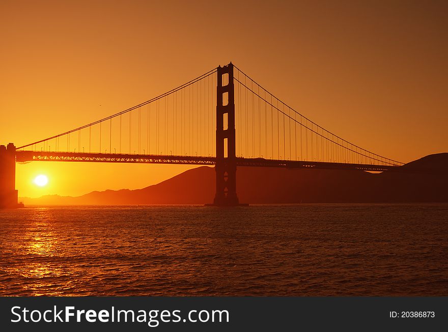 Golden Gate Bridge in a brilliant orange sunset