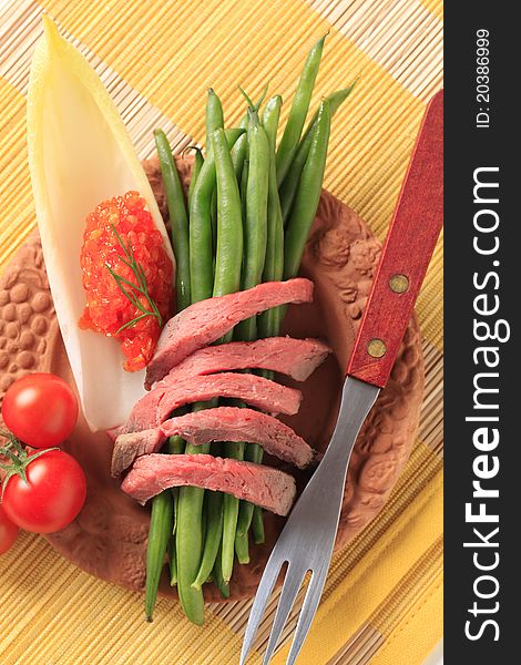 Strips of roast beef and fresh vegetables. Strips of roast beef and fresh vegetables