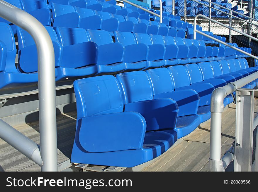 Blue seats at a sports stadium's stand. Blue seats at a sports stadium's stand