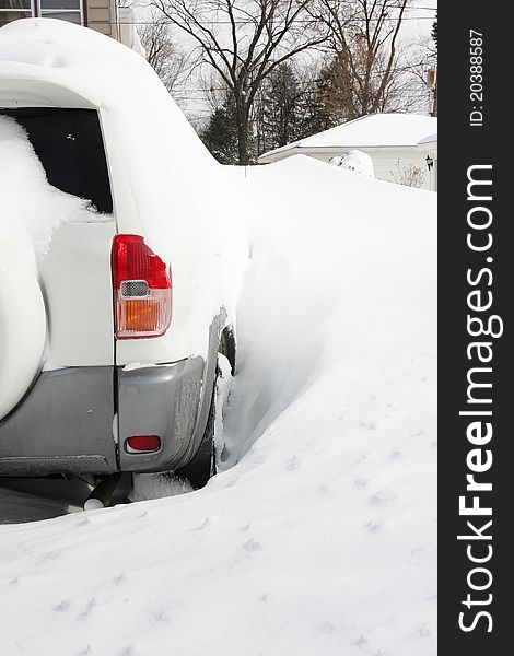 Small SUV, car buried in snow. Small SUV, car buried in snow