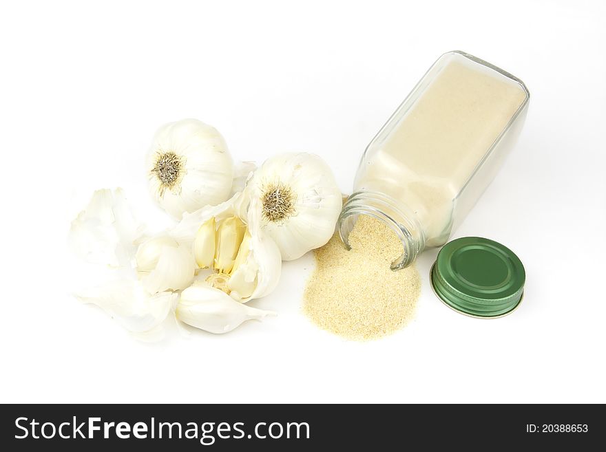 Garlic and Garlic Powder in a glass container. Garlic and Garlic Powder in a glass container