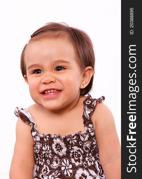 Smiling baby girl isolated over white background. little