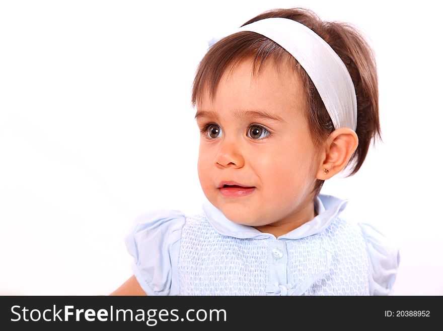 Baby girl with blue dress isolated over white background. Baby girl with blue dress isolated over white background