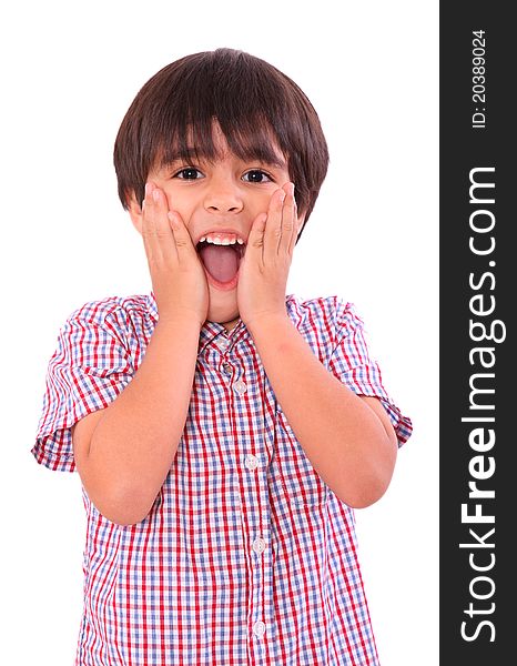 Young child surprised with hands on his face, over white background. Six years old