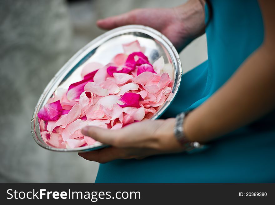 Flower petals ready to be tossed at wedding ceremony