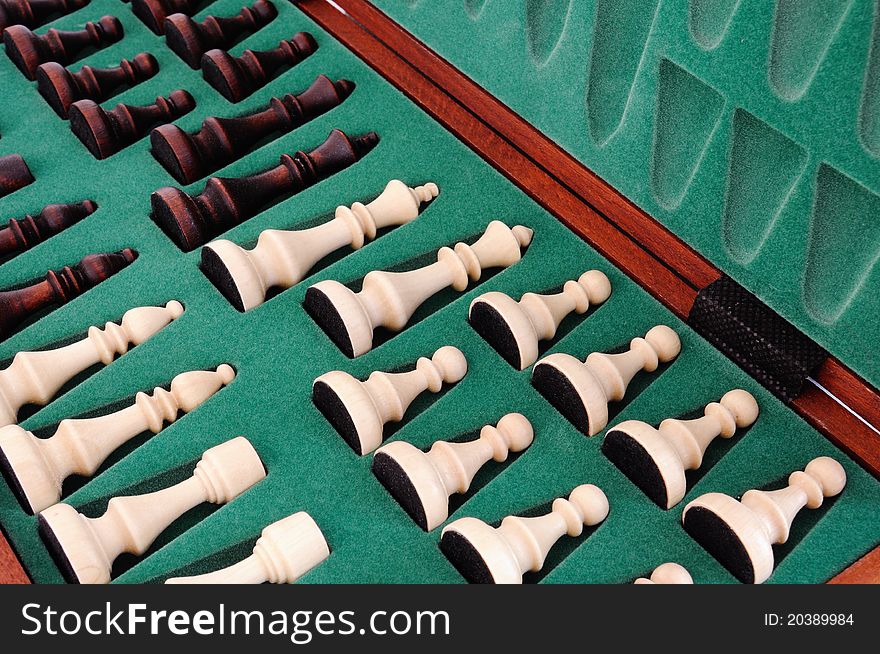 Chess pieces on box, black and white