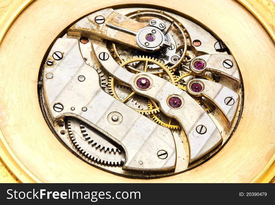 Background of the inside workings of a gold watch. Background of the inside workings of a gold watch