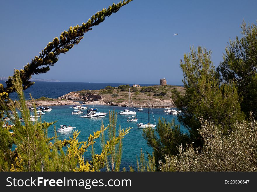 Luxury yachts in an idyllic bay in the Mediterranean. Luxury yachts in an idyllic bay in the Mediterranean