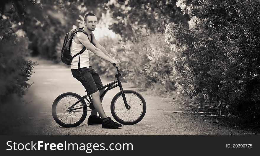 Young man sitting on bike. Young man sitting on bike