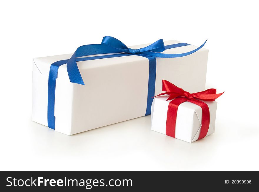 Roll of paper with gift box on white background