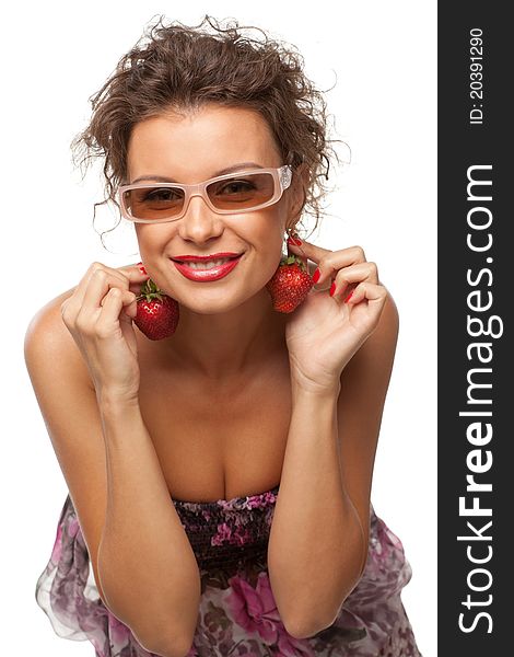 Closeup portrait of young female holding strawberry like earrings, isolated on white background. Closeup portrait of young female holding strawberry like earrings, isolated on white background